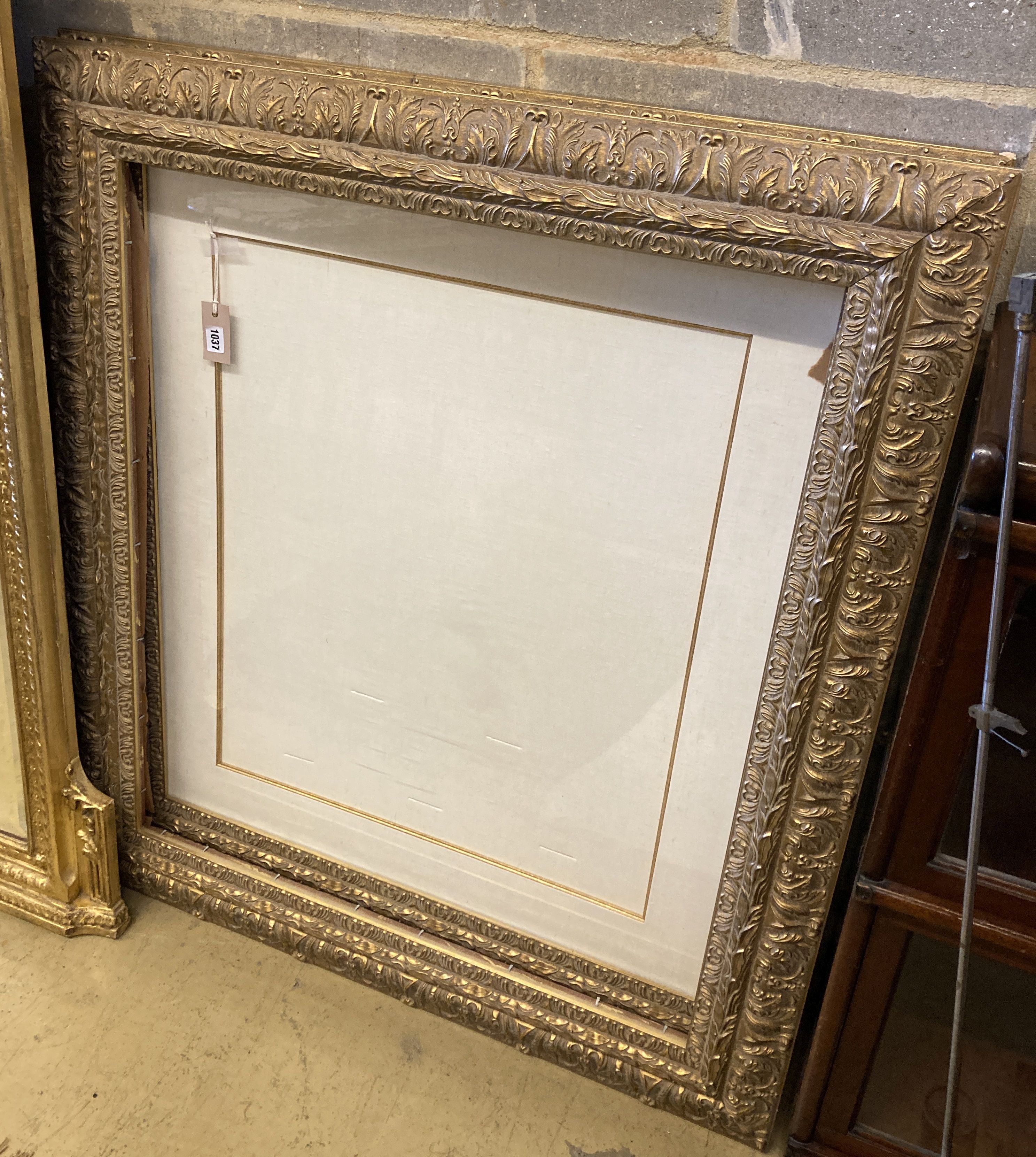 A pair of Victorian style rectangular gilt picture frames, width 99cm, height 112cm
